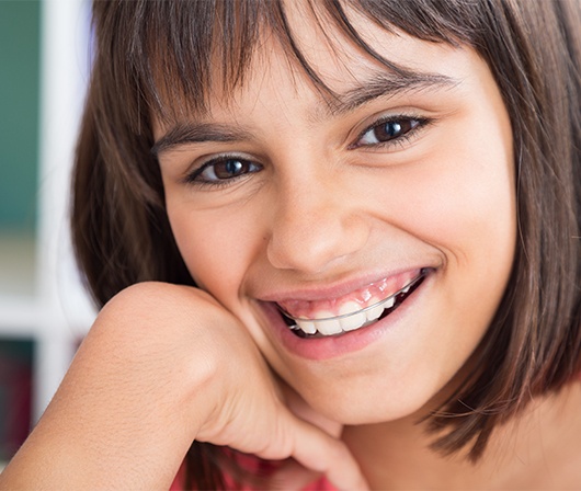 girl smiling with retainer on