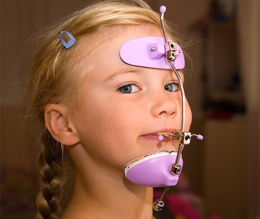 pink head gear on young female patient