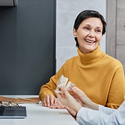 a dentist talking to a patient