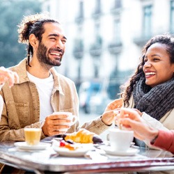 friends having lunch together and smiling