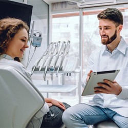 an orthodontist in Dallas explaining the Invisalign process