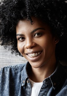 smiling man with braces