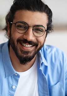 smiling man with braces