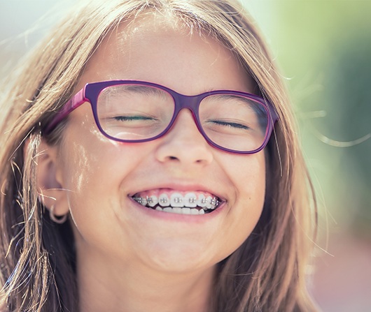 girl laughing with phase two braces