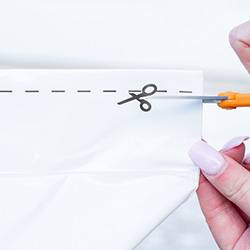 Dallas patient using scissors instead of teeth to open package