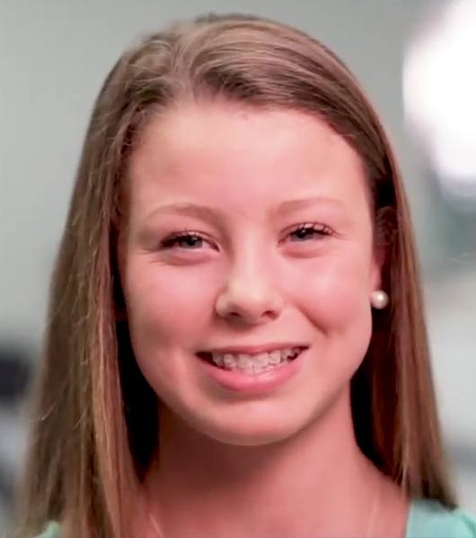 teen girl with braces smiling at camera