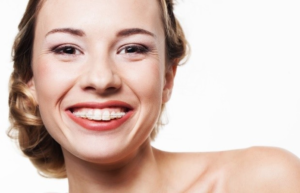 a patient showing off her healthy smile